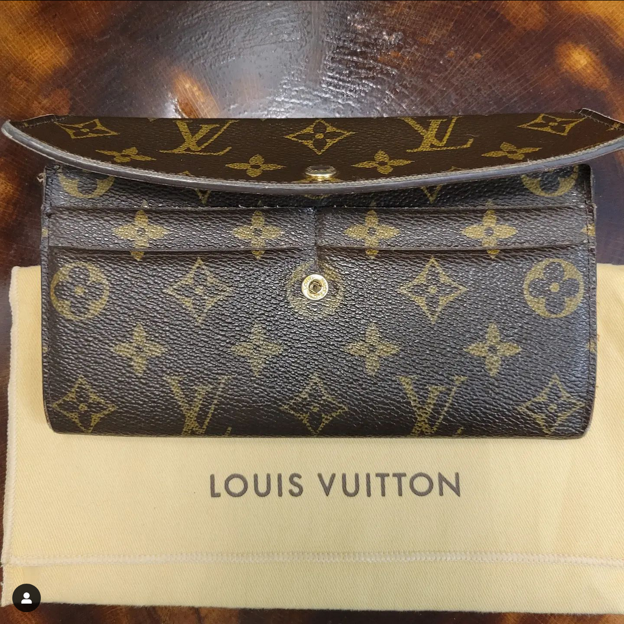 Brown and tan wallet on a tan background